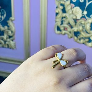 Adjustable white bow ring